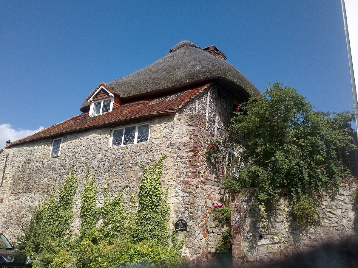 A cottage with thatched and tiled roofs, Amberley