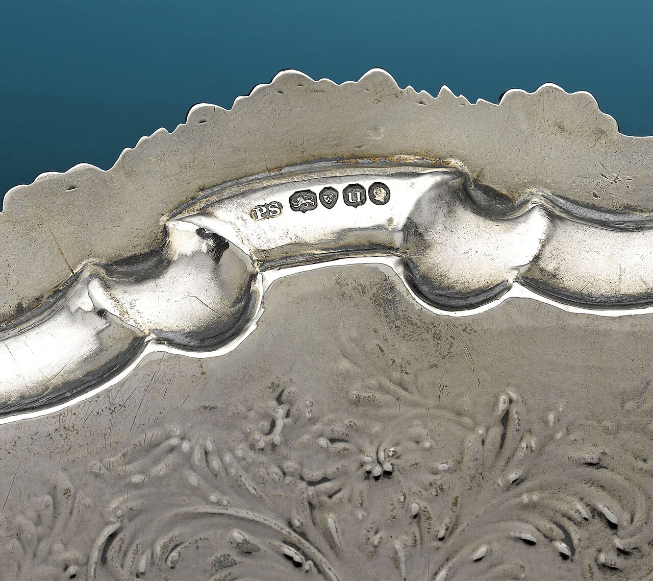 Hallmarks and the maker's mark of the Regency silversmith Paul Storr on the rim of a silver salver