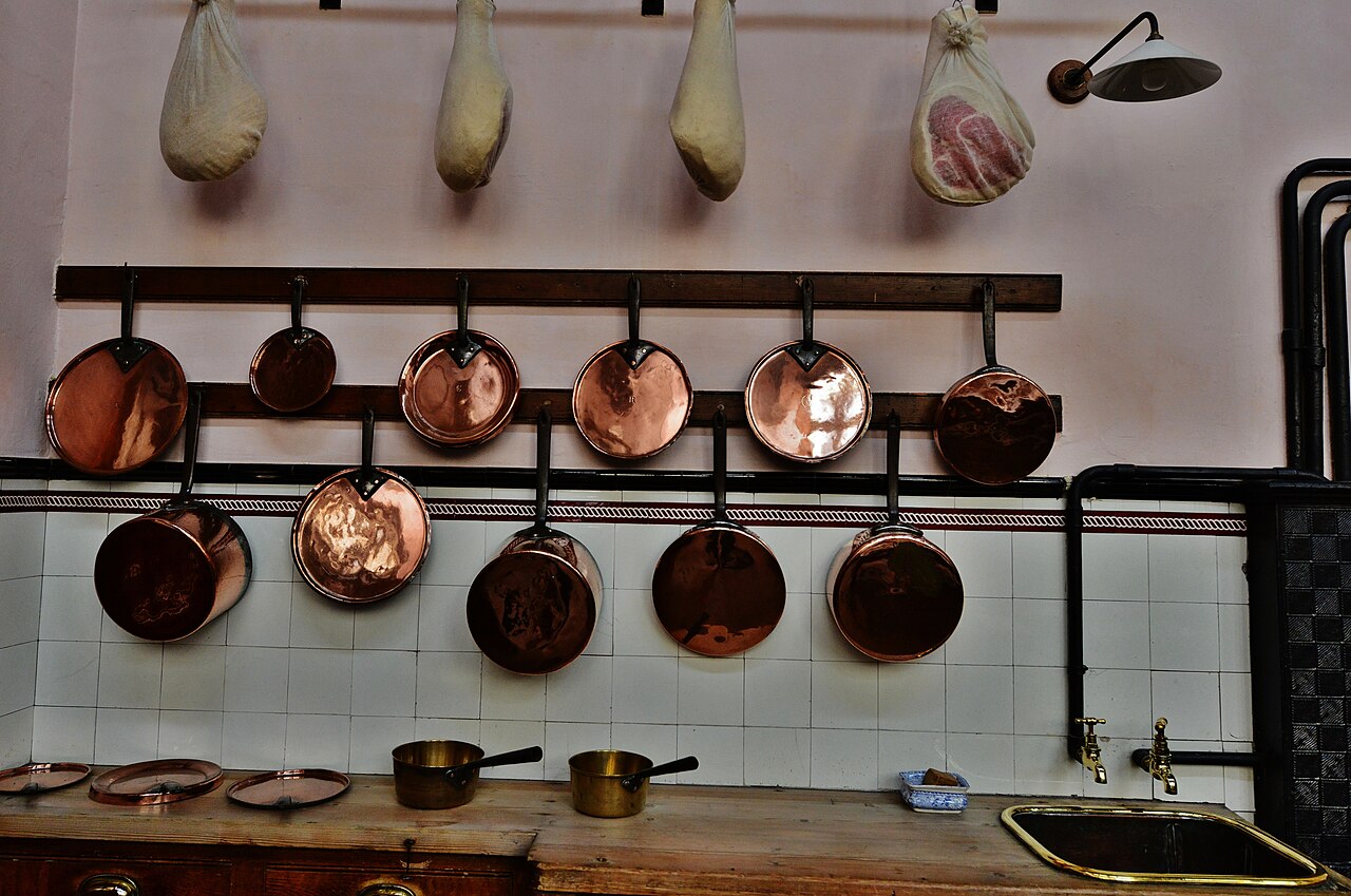 Copper pans in the Victorian kitchen at Lanhydrock, Cornwall